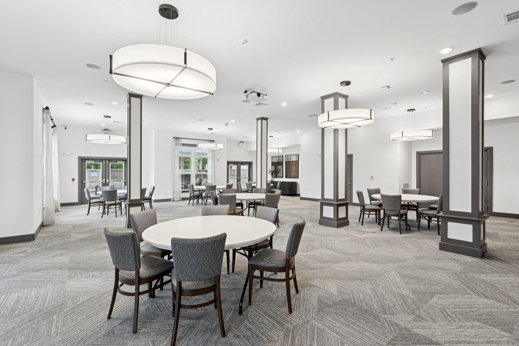 a communal area with tables and chairs in a large room at The Leo Myrtle Beach, South Carolina, 29579