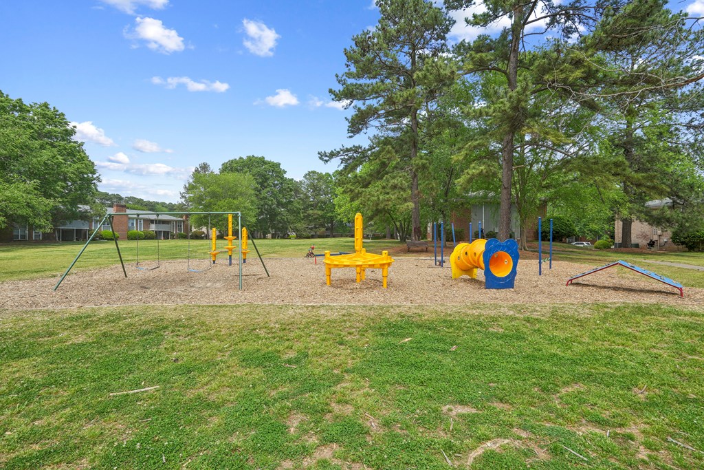 A playground with a yellow slide at Lexington on the Green, North Carolina
