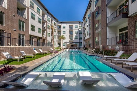 Outdoor pool with Apartment Building View at The Monroe Apartments, Austin, TX, 78741