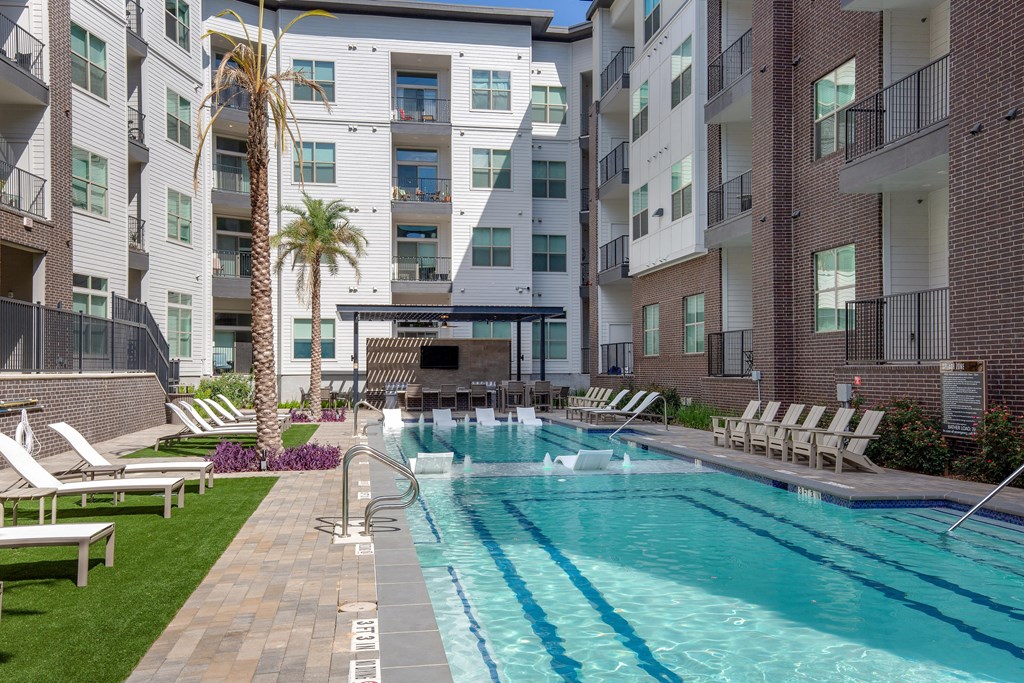 our apartments have a large pool and lounge chairs at The Monroe Apartments, Austin