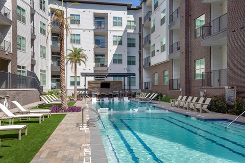 our apartments have a large pool and lounge chairs