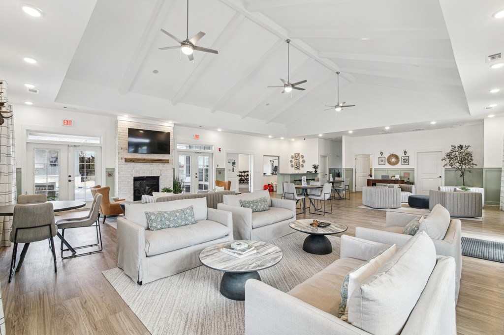 Clubhouse interior with couches and chairs and a fireplace at The Parker North Augusta, North Augusta, South Carolina, 29841