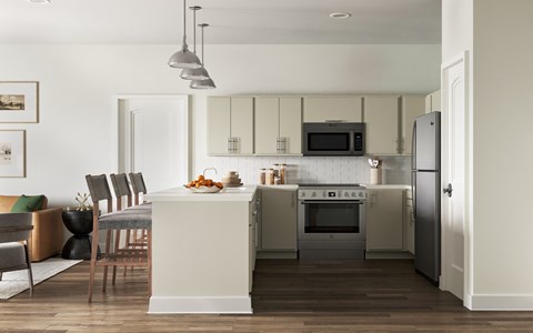 A modern kitchen with a dining table at The SoHo Luxury Apartments, Raleigh, NC