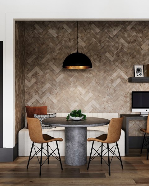 A modern dining room with a round table and chairs at The SoHo Luxury Apartments, Raleigh, NC