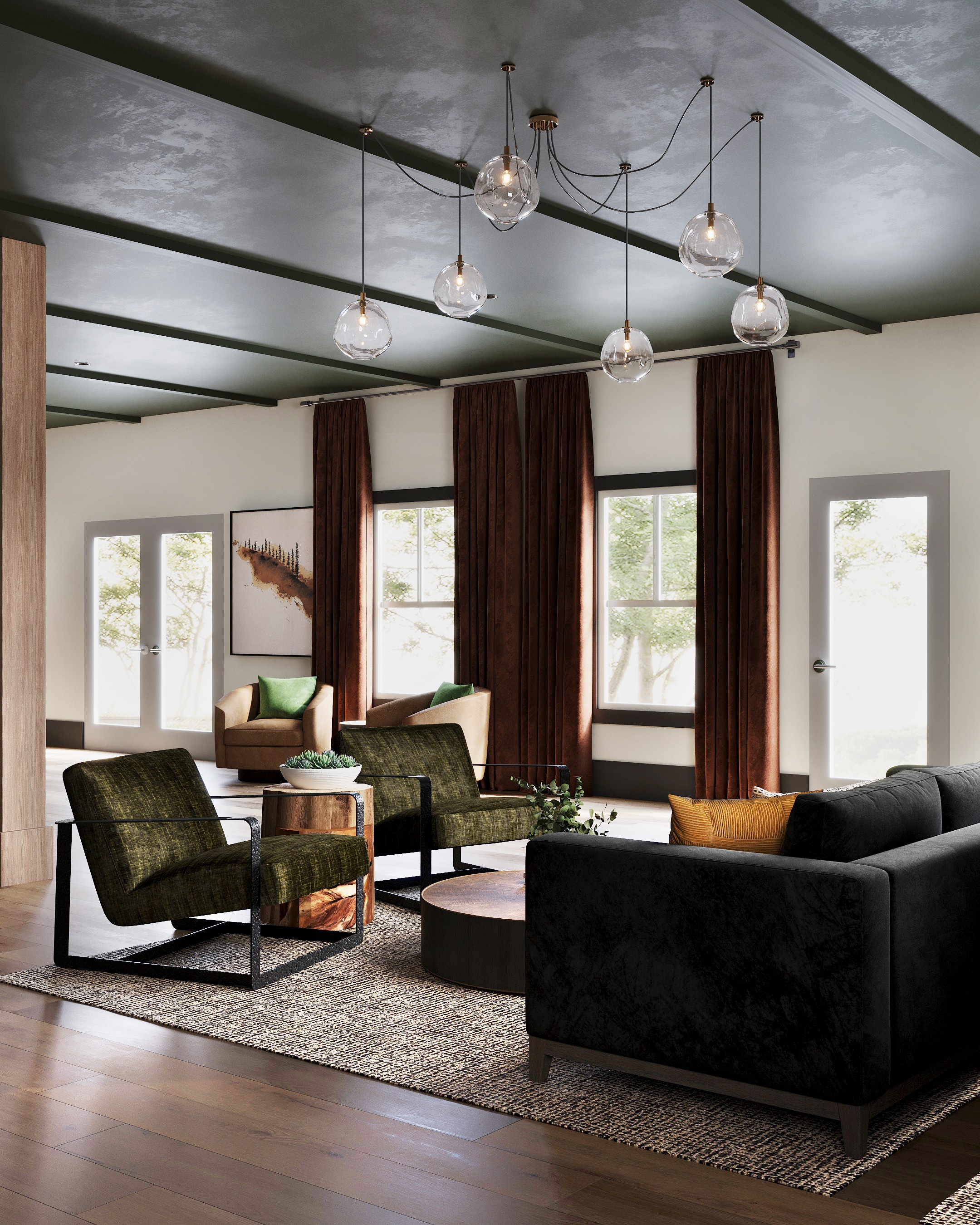 A living room with a black couch and a green chair.
