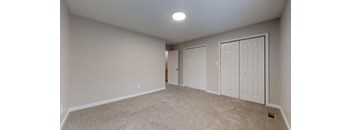 Bedroom with two closets at the Colonial Village Apartments, Lincolnton, NC.
