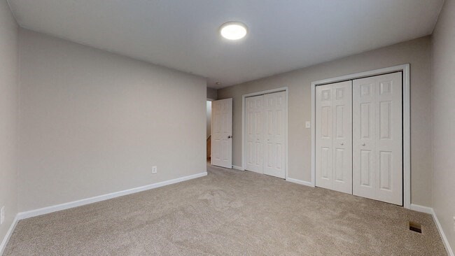 Carpeted bedroom at the Colonial Village Apartments, Lincolnton, North Carolina. 