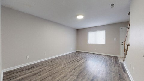 Living room with wood floors at the Colonial Village Apartments, Lincolnton, North Carolina. 