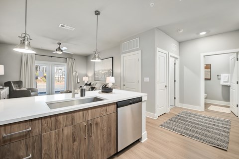 A modern kitchen with wooden cabinets and stainless steel appliances.