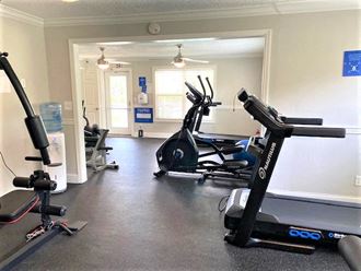 a gym with some exercise equipment in it