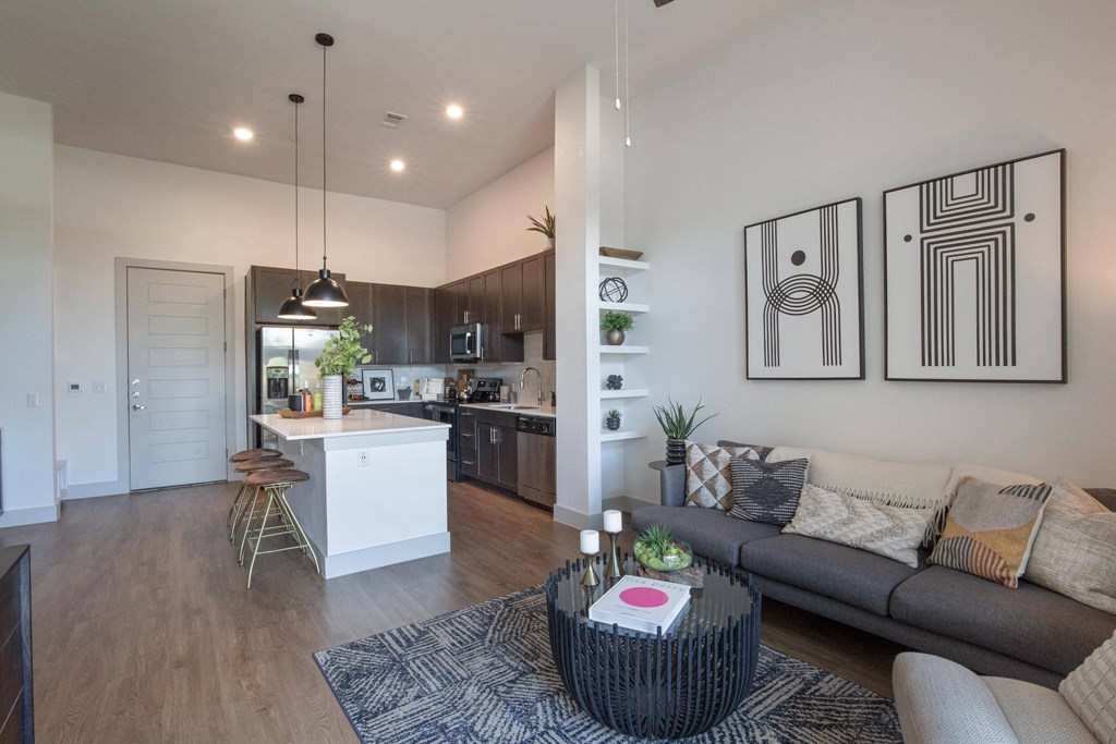 a living room with a couch and a table at The Monroe Apartments, Austin