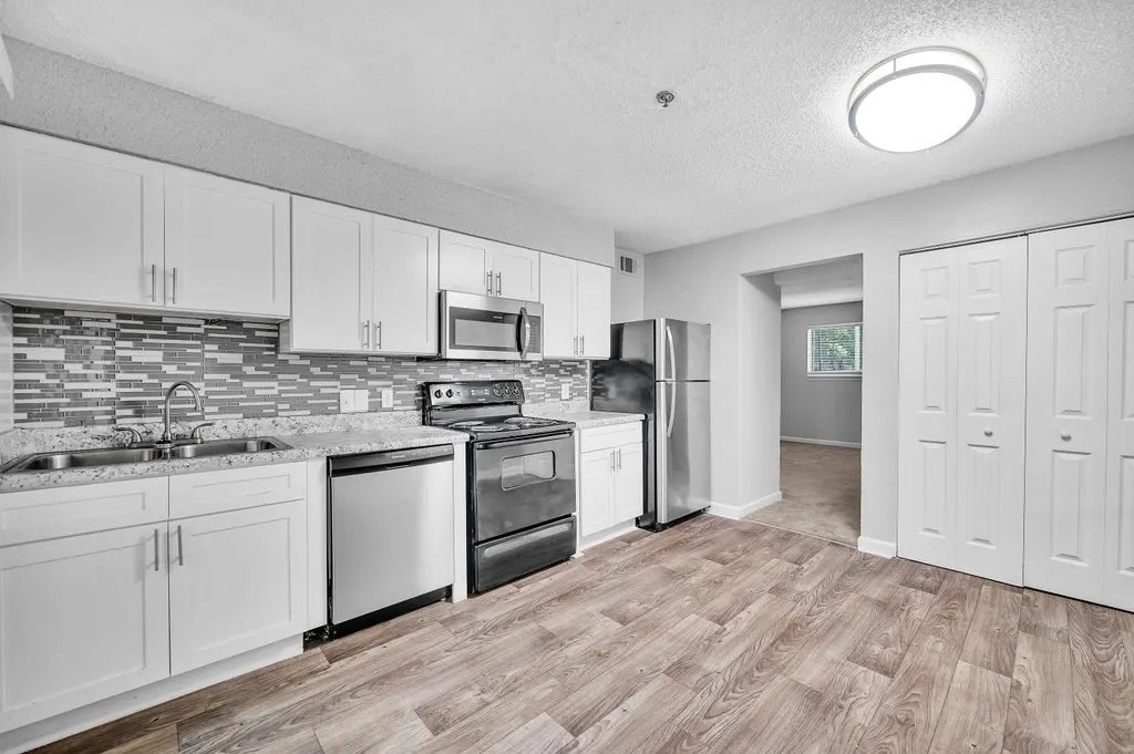 A Kitchen With White Cabinets at Avondale Place Apartments, Avondale Estates, 30002