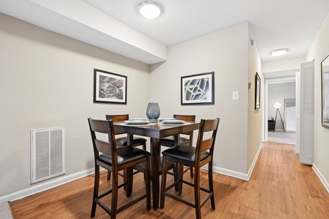 Dining area with high top table and chairs at The Palms Apartments, Charleston, SC