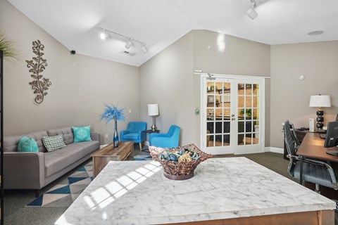 A living room with a marble table and a couch  at Cape Landing, Myrtle Beach, 29588