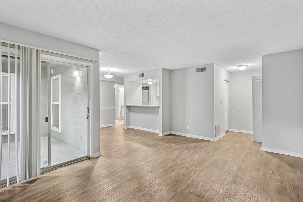 A room with a wooden floor and white walls.