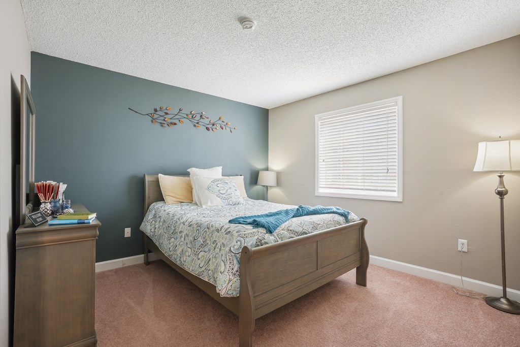 Bedroom with a bed and a dresser and a window  at Cape Landing, Myrtle Beach, South Carolina
