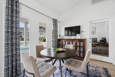 Dining area with round table and tv at Viera Aiken Apartments, Aiken, SC 29803