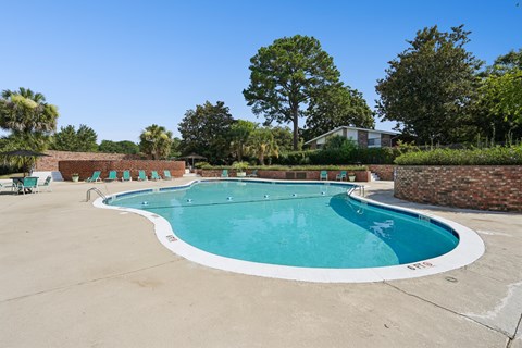 Large swimming pool with brick wall surround at The Palms Apartments, South Carolina, 29407