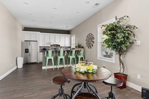 Open kitchen with breakfast bar and mint green stools at The Lory of Greenway Village Apartments, Kentucky, 42001