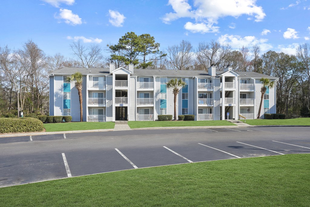 Apartment building with a parking lot in front of it  at Cape Landing, Myrtle Beach, 29588
