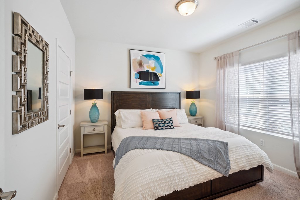 Bedroom with a large bed and a window  at The Meadows, Georgia, 31302