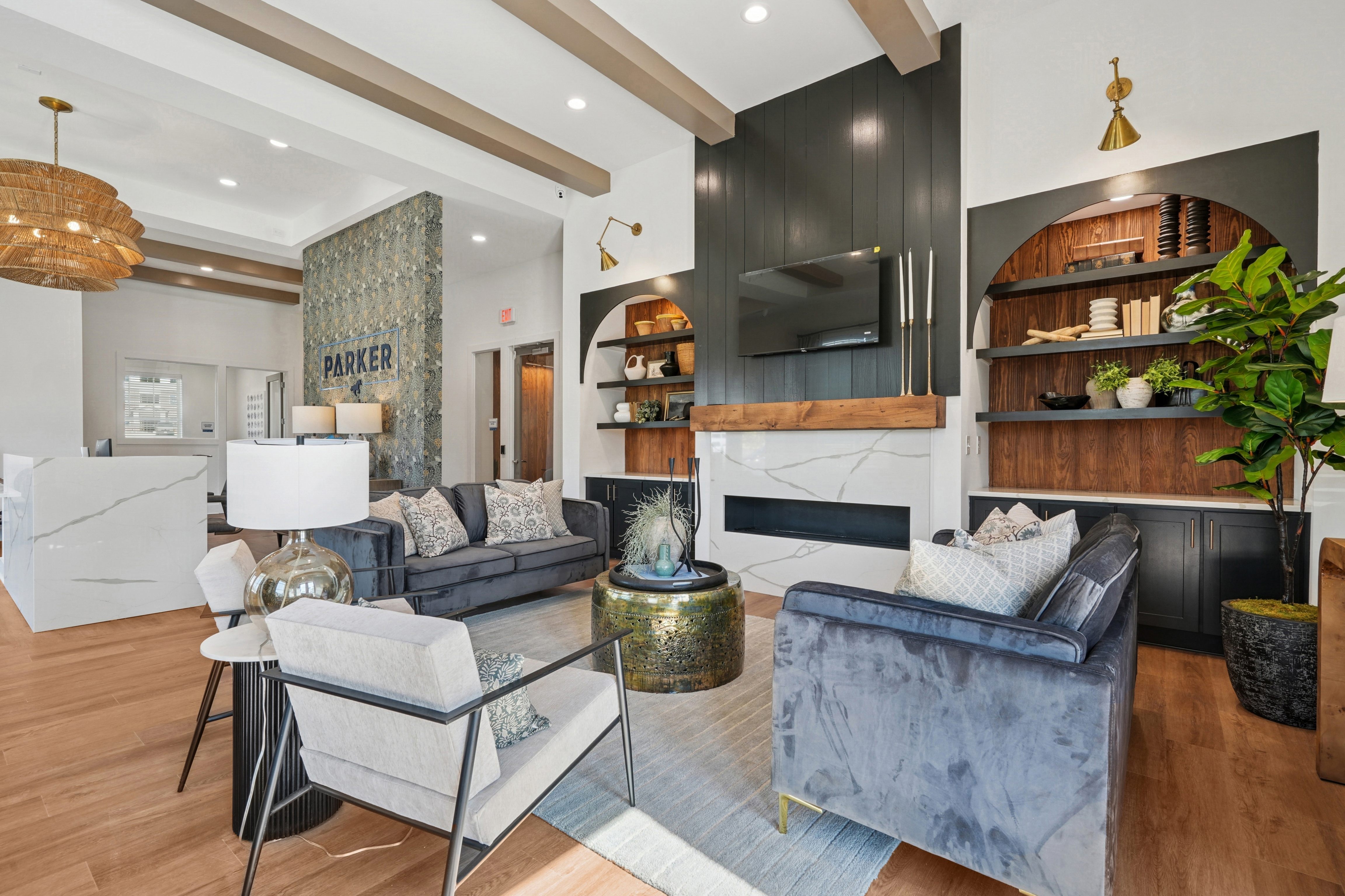 A living room with a grey couch and a coffee table.
