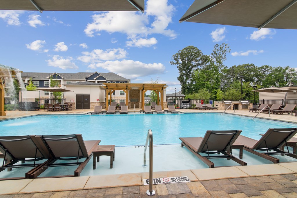 Pool With Lounge Chairs at The Delaney at East Park Apartments, Kennesaw, 30144