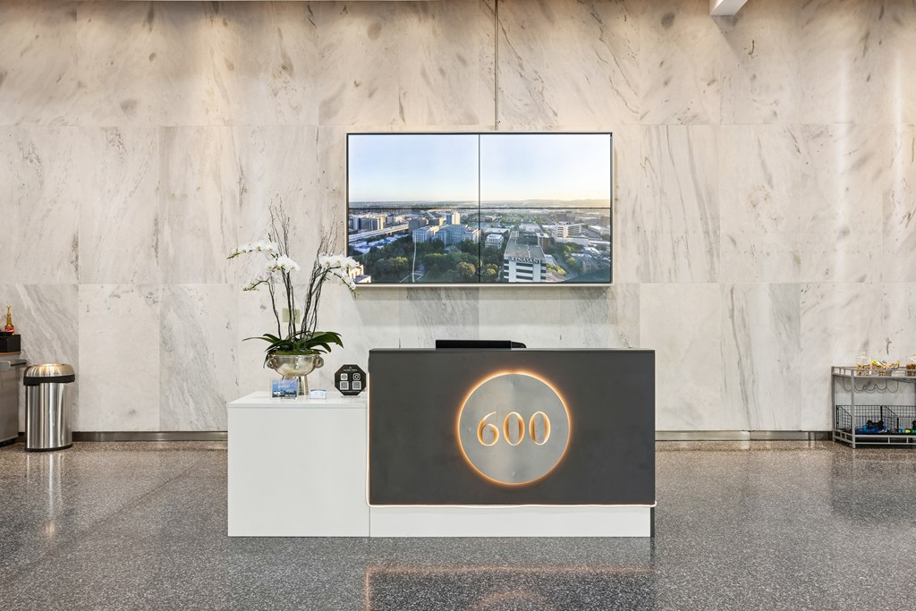 A reception desk with the number 600 on it.