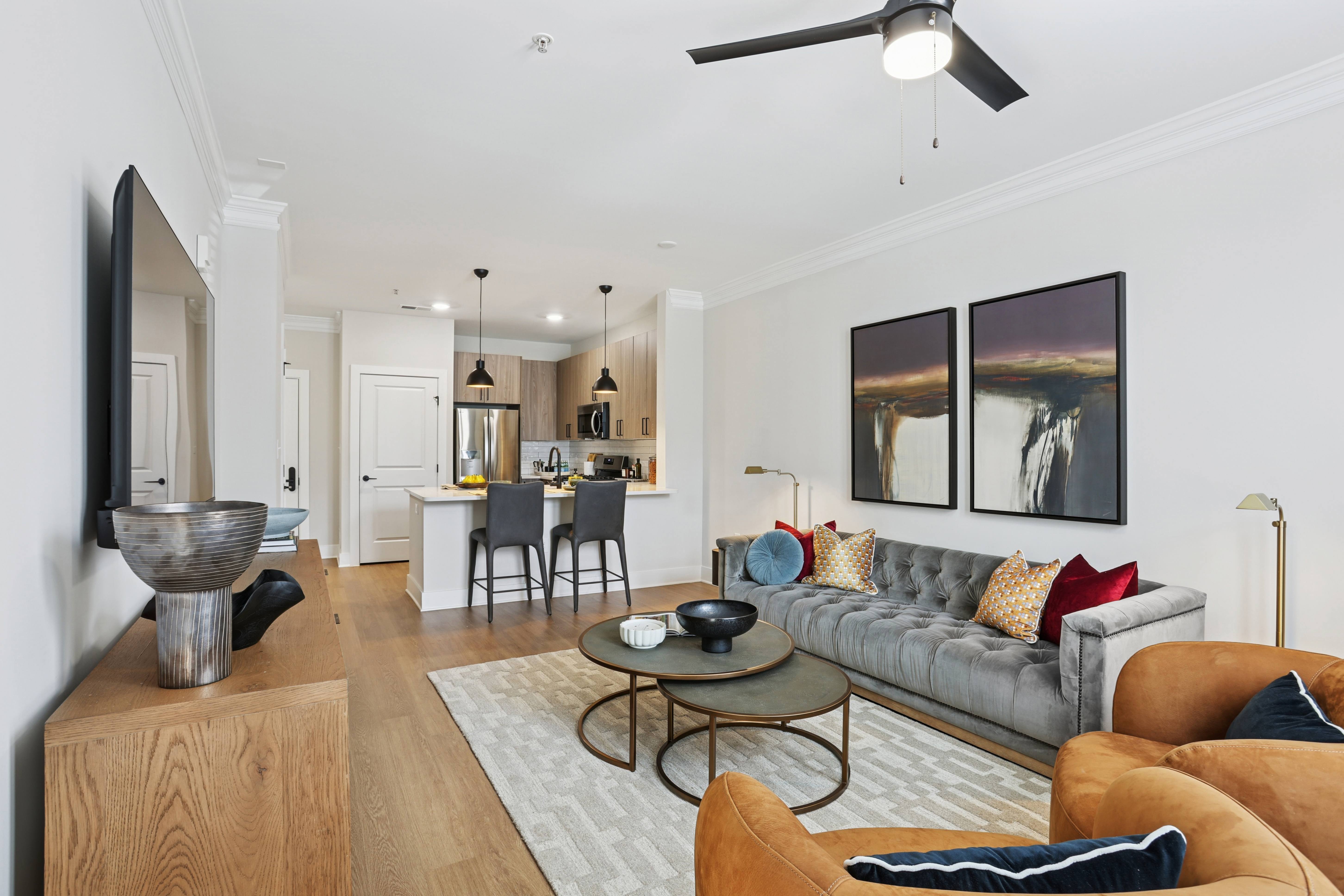 A living room with a grey couch and a coffee table.