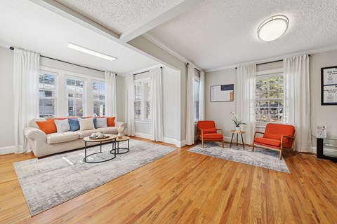 A living room with a white couch and a coffee table.