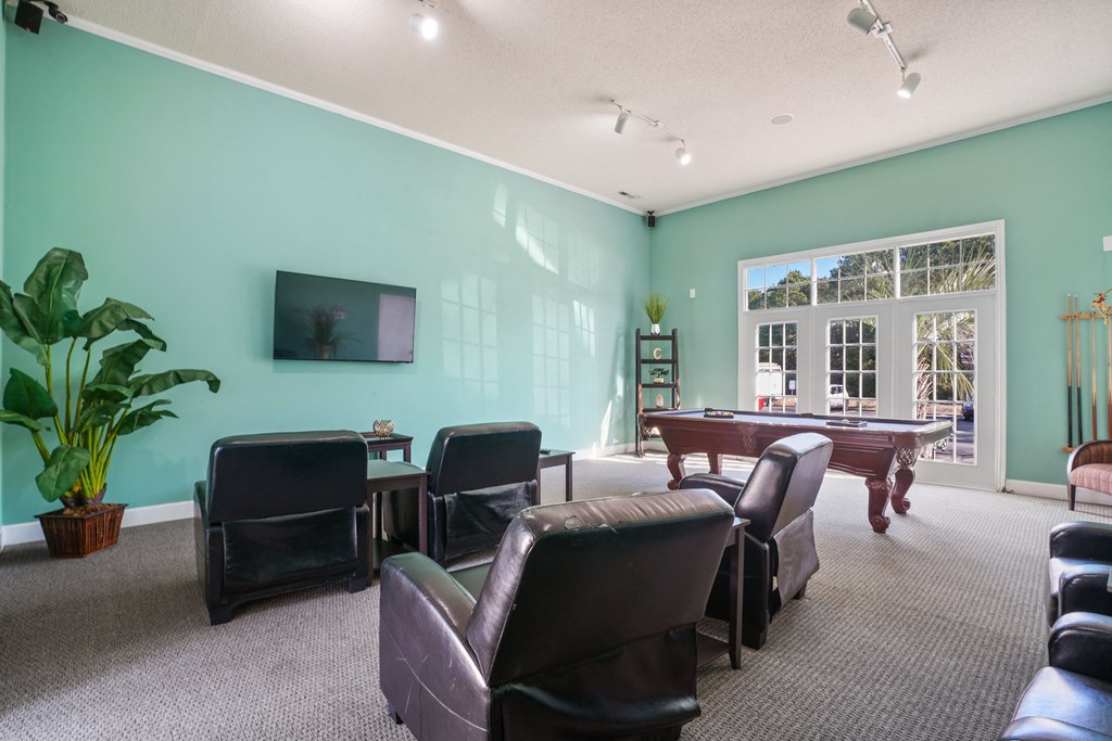 Living room with a pool table and chairs  at Cape Landing, Myrtle Beach
