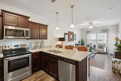 Kitchen with stainless steel appliances and a granite counter top