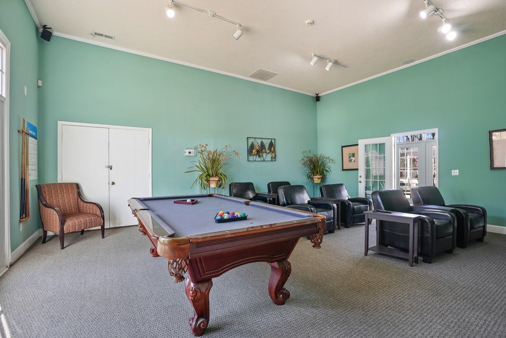 Game room with a pool table and leather furniture  at Cape Landing, Myrtle Beach, 29588