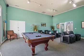 Game room with a pool table and leather furniture  at Cape Landing, Myrtle Beach, South Carolina