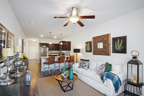Living room with a white couch and a ceiling fan  at The Meadows, Bloomingdale, Georgia
