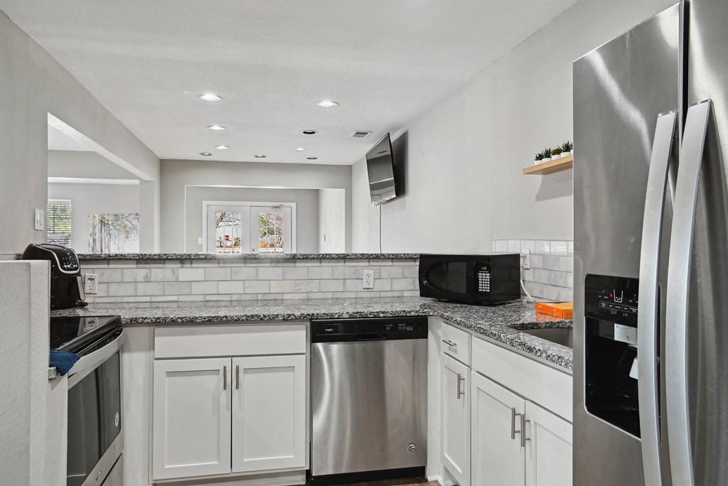 Kitchen with stainless steel appliances and granite counter tops at Emerald Bay, Charlotte