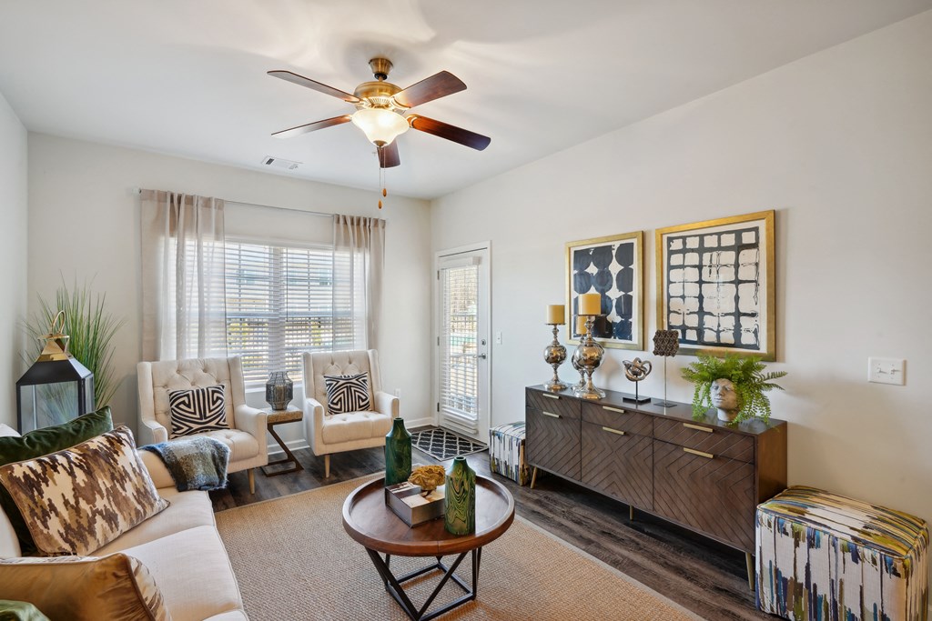 Living room with furniture and a ceiling fan  at The Meadows, Bloomingdale, GA
