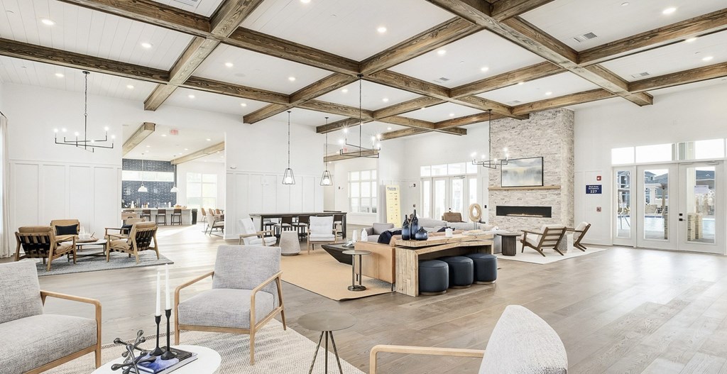 A spacious living room with a fireplace and a dining table set up. A spacious living room with a fireplace and a dining table set up at The Exchange at Crestview Apartments, Crestview, Florida