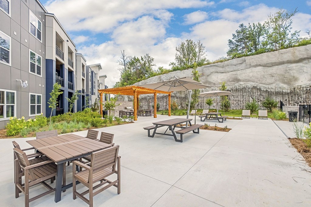 A patio with a table and chairs and a pavilion at The Percy Apartments, Nashville, Tennessee