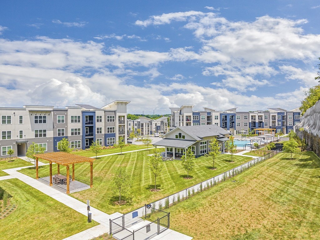 A large building complex with a playground in the foreground at The Percy Apartments, Nashville, 37214