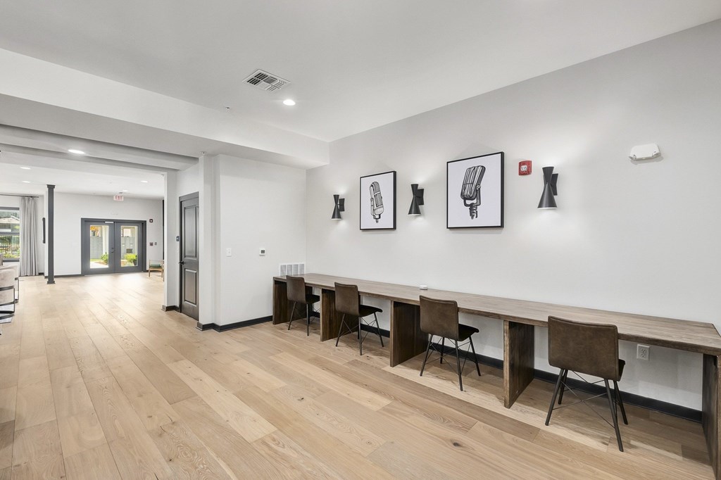 A room with a long table and chairs at The Percy Apartments, Nashville, TN, 37214