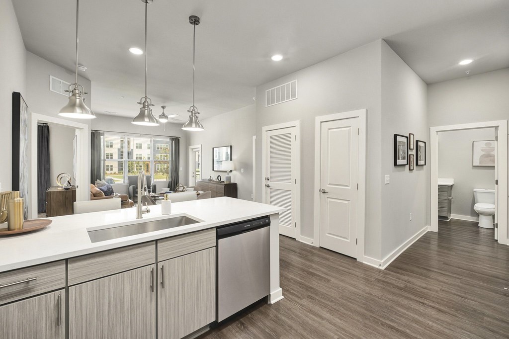 A modern kitchen with a large island and stainless steel appliances at The Percy Apartments, Nashville