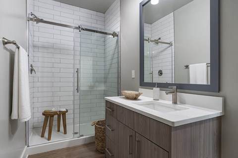 A bathroom with a white sink and a mirror at The Waverly at Winter Haven Apartments, Winter Haven, FL, 33884