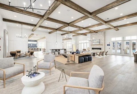 A spacious room with wooden beams and furniture at The Waverly at Winter Haven Apartments, Winter Haven, Florida