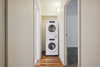 a small laundry room with a washing machine and a dryer