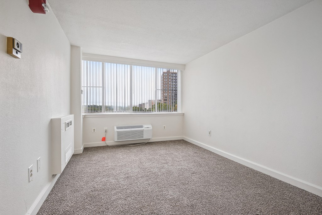 Bright bedroom with plush carpet at Broadstone Van Dorn