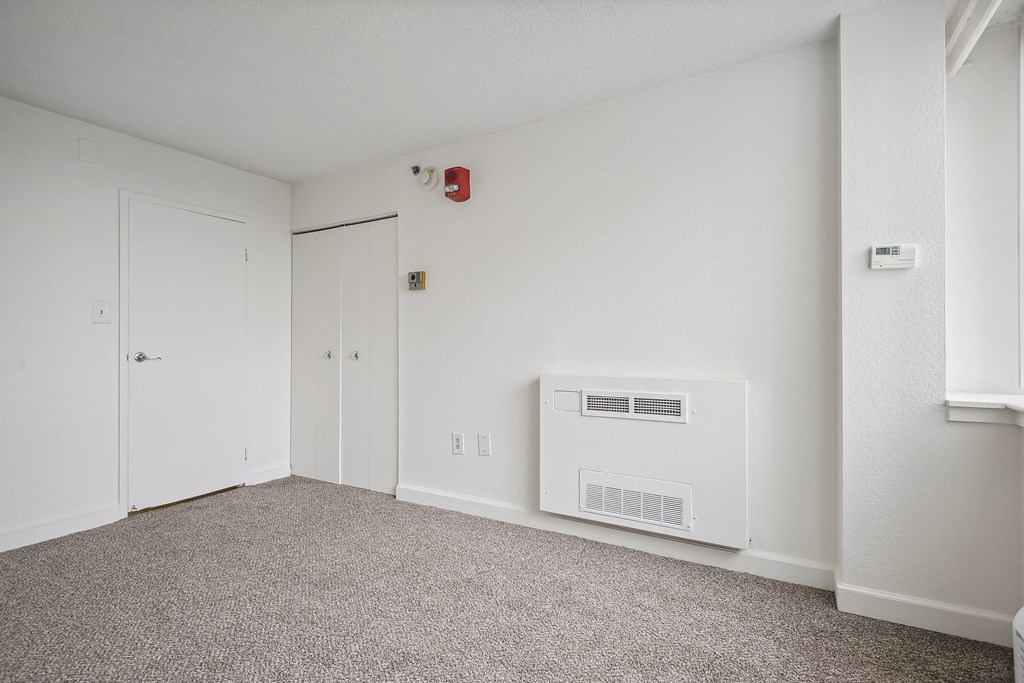 Bright bedroom with plush carpet at Broadstone Van Dorn