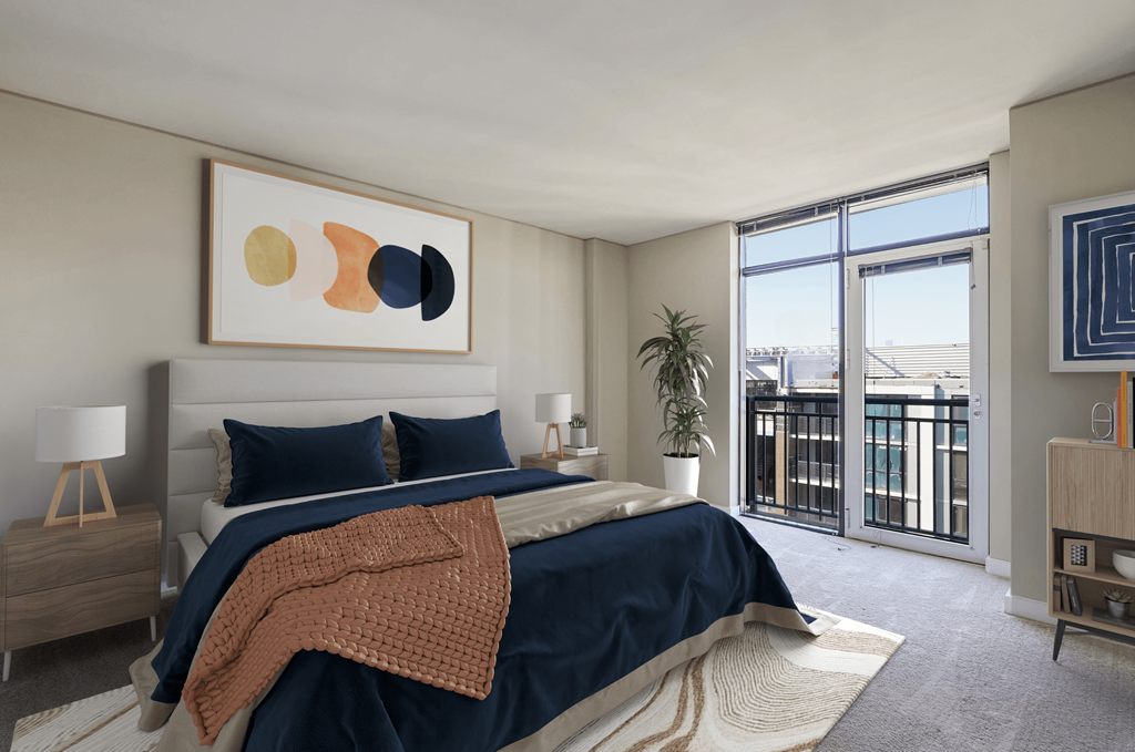 a bedroom with a bed and a large window