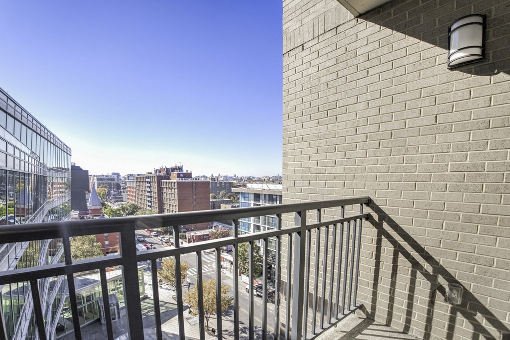 a balcony with a view of the city