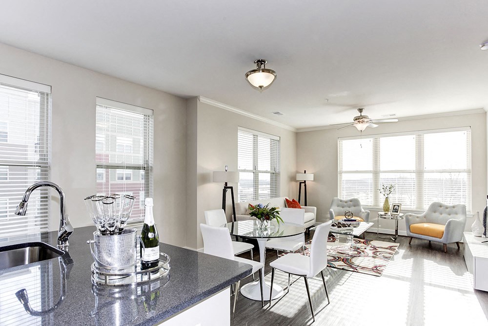 a living room with a kitchen and a dining room
